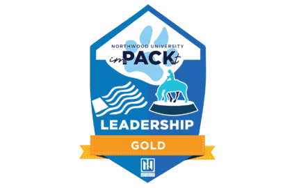 A badge featuring Northwood University's "inPACKt" program, with the words "Leadership Gold" and various symbols, including a hand, flag, and person riding a horse.