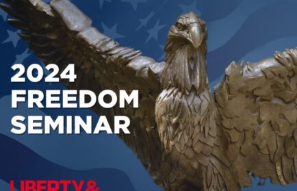 Promotional image for Northwood University's 2024 Freedom Seminar featuring a bronze eagle statue. Text reads "Liberty & Business for All.