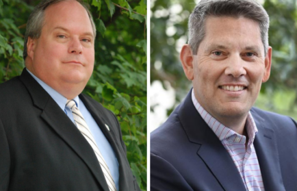 Two men in suits stand sharp and poised; the one on the left is framed by lush foliage, while the other poses outdoors against a backdrop of blurred greenery. Their presence naturally commands attention, much like keywords driving SEO in an Auto Draft process.