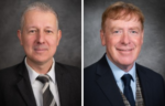Two middle-aged men in suits, both Professors, pose separately against a gray studio background, facing the camera and smiling mildly—perfect for an Ask the Experts feature on WalletHub.