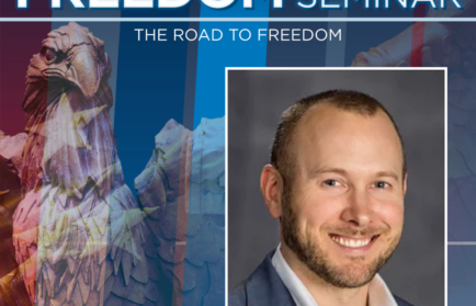A promotional image for the 2025-2026 Freedom Seminar at Northwood University, featuring a smiling man in a suit and a statue of an eagle in the background.