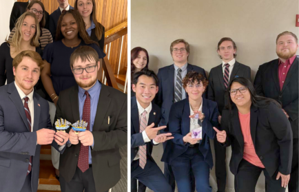 Two groups of young adults in formal attire pose indoors; one group stands on stairs holding paper crowns, the other sits and kneels, holding a small trophy or award.