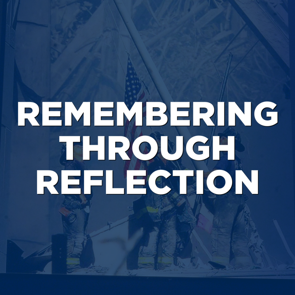 Three firefighters stand amid debris, holding an American flag—a powerful symbol of resilience. Text overlay reads, "Remembering Through Reflection." Their unwavering spirit captures the true essence of Northwood Unity in times of challenge.