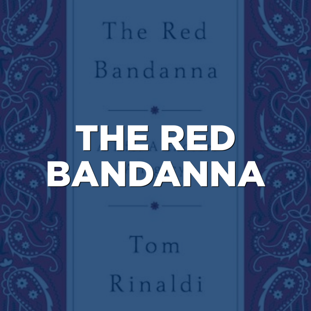 Book cover for "The Red Bandanna" by Tom Rinaldi, featuring a blue background with red paisley borders that evoke the spirit of Northwood Unity, and the title in bold white letters at the center.