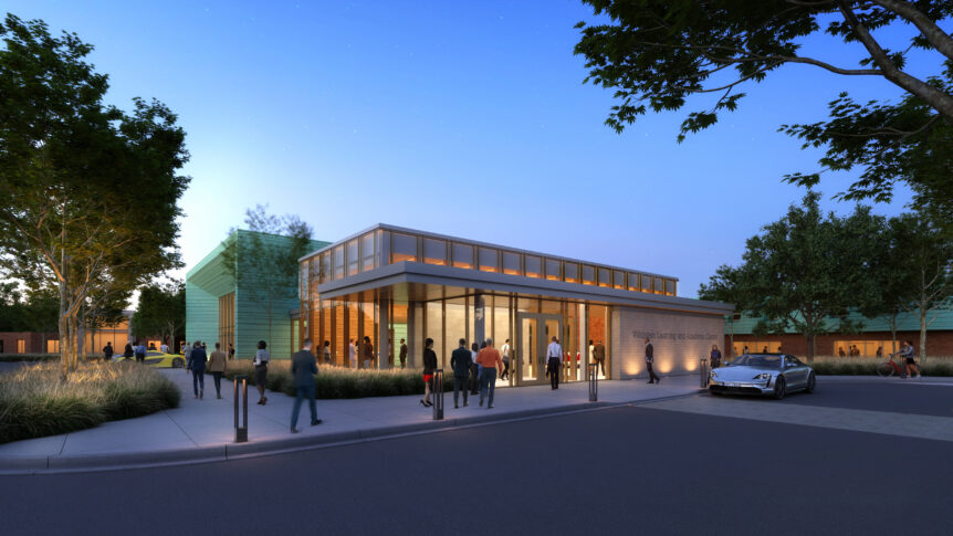People stand and walk near a modern, well-lit building with large windows at dusk; a car is parked nearby and trees line the surrounding area, highlighting this impressive new rendering of the Northwood University academic facility.