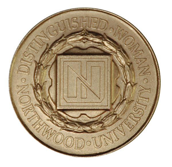 A circular bronze Northwood’s Distinguished Women Awards medal featuring an “N” inside a square at the center surrounded by a laurel wreath.