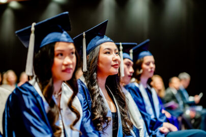 A photo of international students wearing Northwood graduation attire