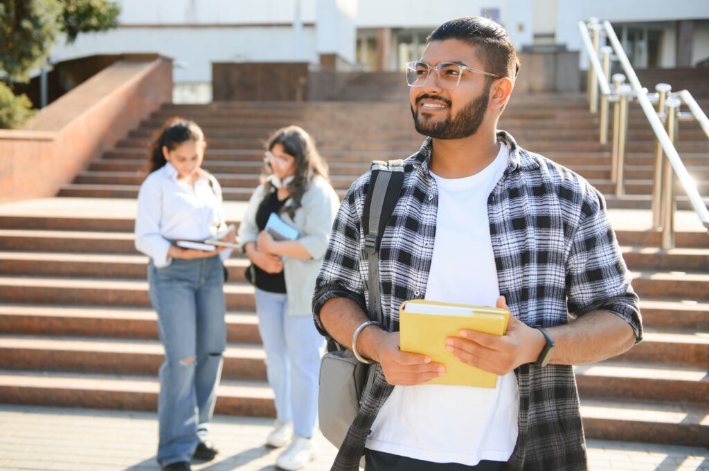Happy male student at the university. 