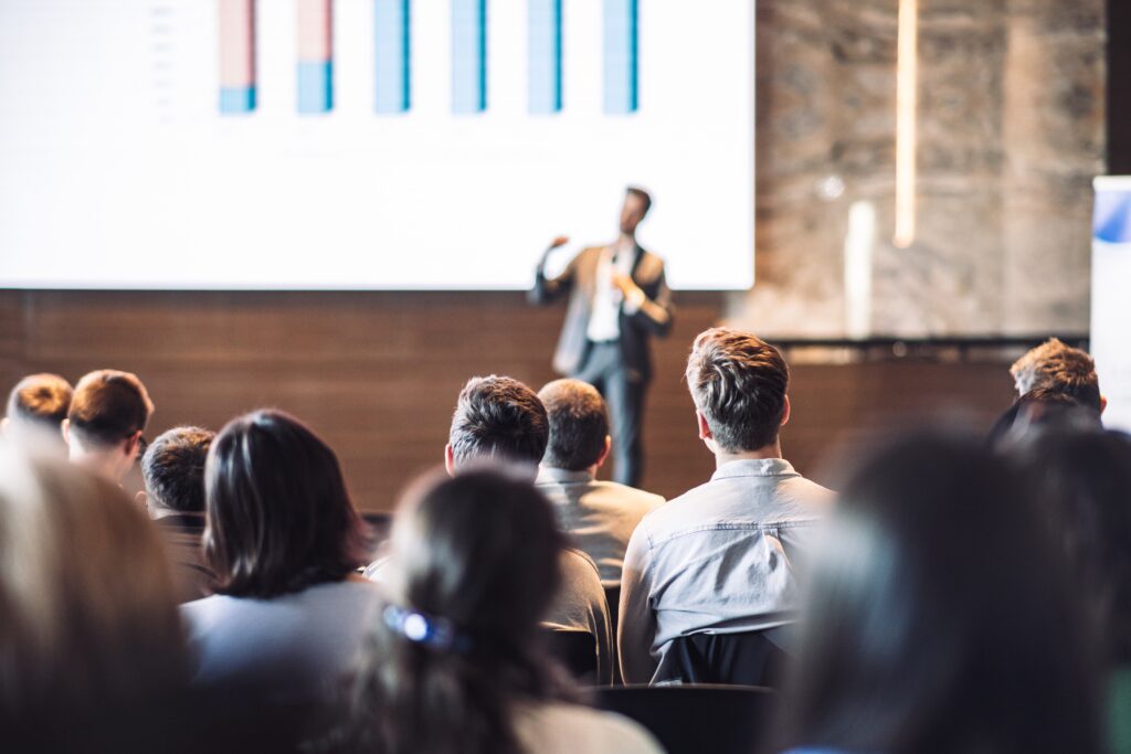 A speaker giving a talk at a conference.