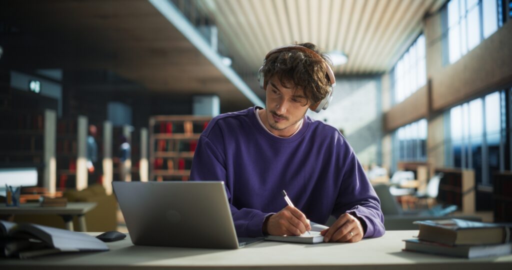 Student preparing for class, taking notes. 